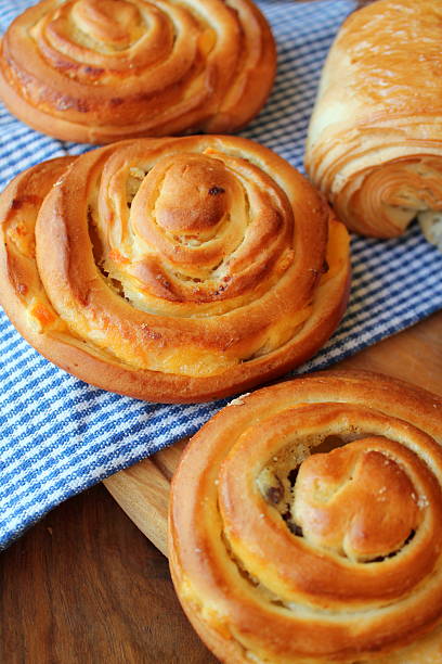 istock Fresh buns on wooden table 502086681