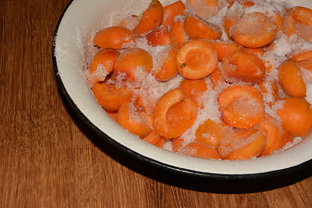istock Cooking apricot jam in a pan 502087193