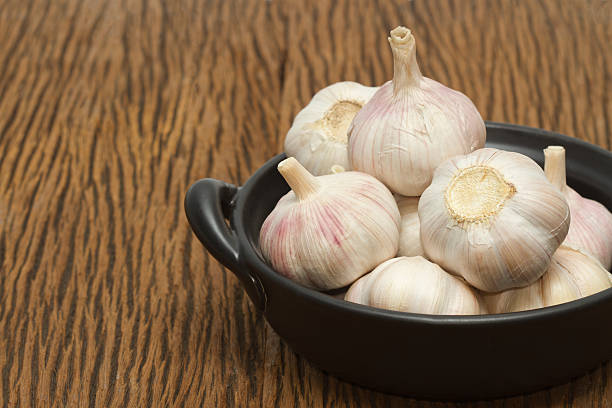 istock Organic garlic on the wooden background 502087997