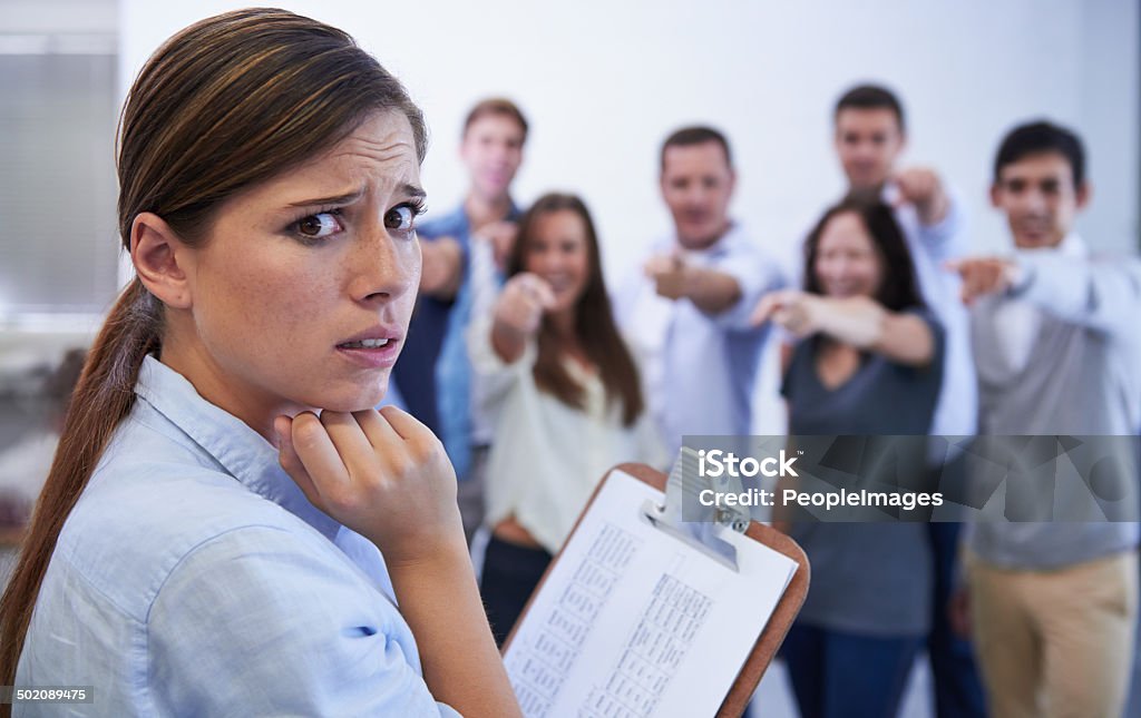 I don't think it's going well Shot of an anxious young woman facing the accusatory fingers of her coworkershttp://195.154.178.81/DATA/i_collage/pi/shoots/783578.jpg Physical Pressure Stock Photo