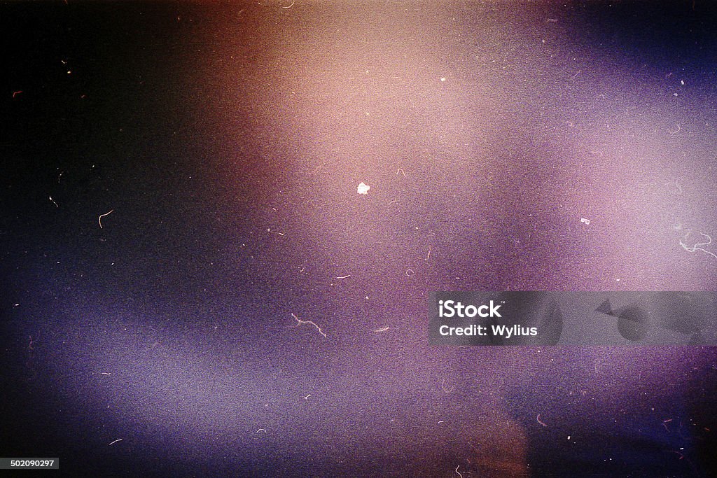 Designed film background Designed film background with heavy grain, dust and light leak Textured Stock Photo