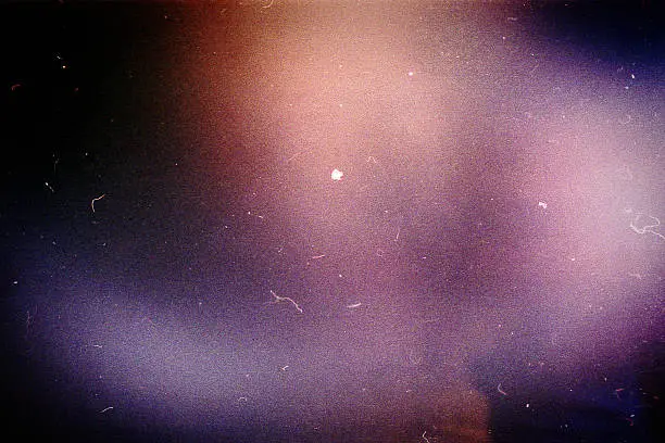 Designed film background with heavy grain, dust and light leak