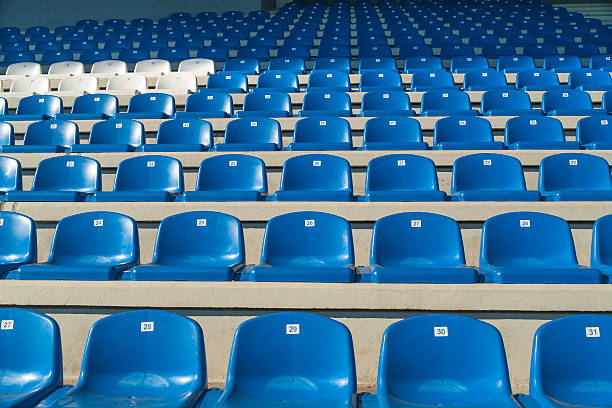 Empty bleachers - Stadium seats stock photo