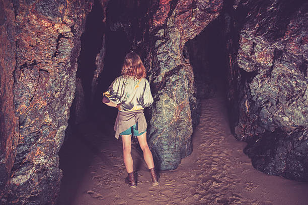 istock Woman standing in cave 502091919
