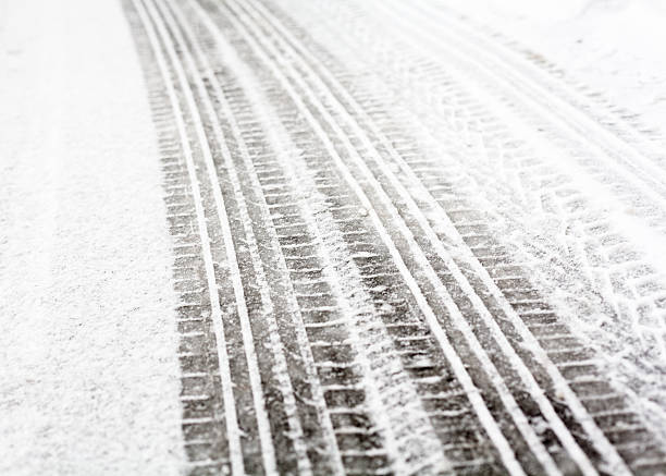 istock Wheel tracks on the road covered with snow 502093132