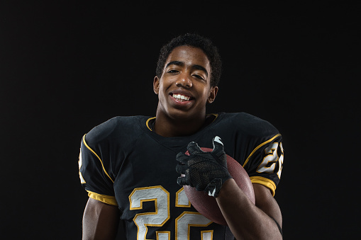 Portrait of an African American football player.