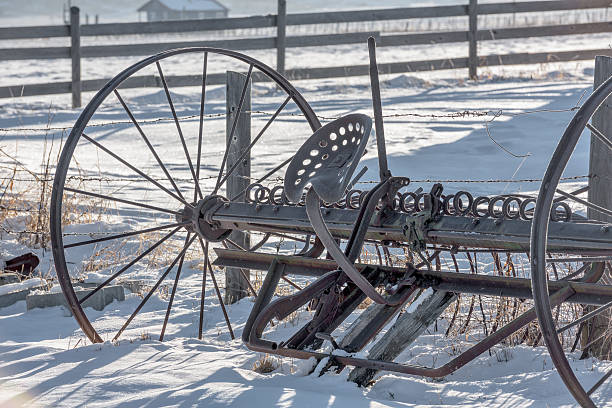 istock Rusty old steel field rake with frost and snow 502094834
