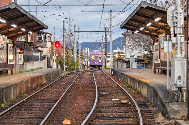 Kyoto, Japan - November 24, 2015: Train station in Kyoto. Photo taken during an overcast day while a train is departing the station.