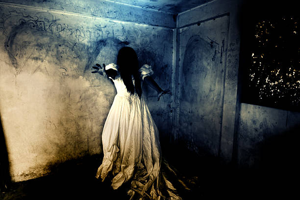 Ghost Woman in Ruins Place Ghost in Haunted House,Mysterious Woman in White Dress Standing in Abandon Building,Horror Background For Halloween Concept and Book Cover Ideas scary bride stock pictures, royalty-free photos & images