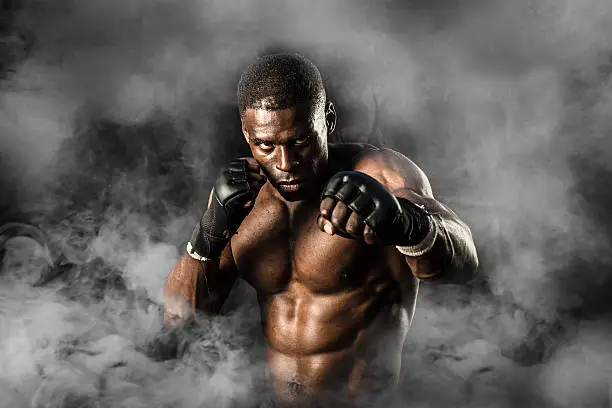 Photo of MMA Fighter On A Smokey  Background