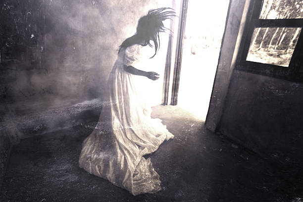 White Dress Woman in Haunted House Ghost in Haunted House,Mysterious Woman in White Dress Standing in Abandon Building,Horror Background For Halloween Concept and Book Cover Ideas scary bride stock pictures, royalty-free photos & images