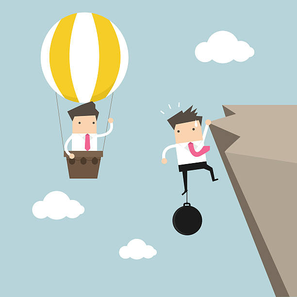 istock Businessman in balloon fly pass businessman hold on the cliff 502097500