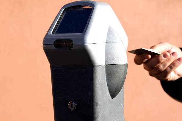 istock Hand Ready to Swipe Card at Parking Meter (Close-Up) 502098022