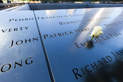 New York City, US - October 06, 2015: National September 11 Memorial in Lower Manhattan. It commemorates the September 11, 2001, attacks, which killed 2,977 victims, and the World Trade Center bombing of 1993, which killed six. 