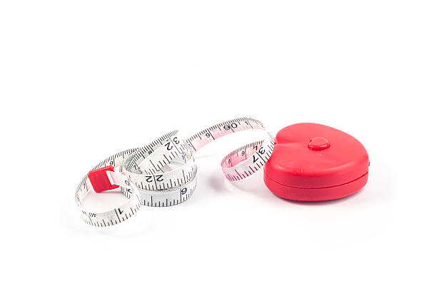 istock Measuring tape in heart shape on white background 502100796