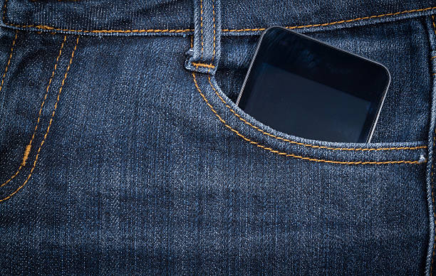 istock Black smartphone in your pocket jeans. background. 502101030