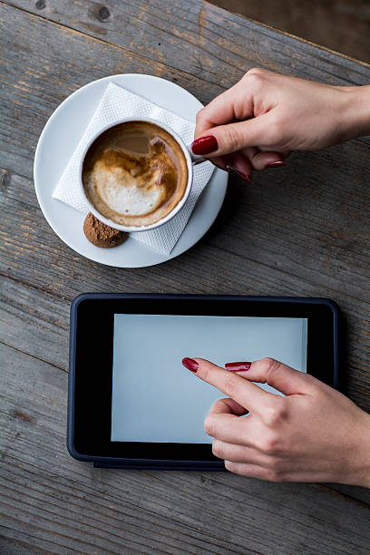 istock Woman' s hand touch tablet 502102286