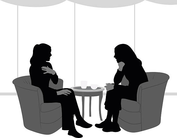 Silhouette Of Intimate Talk Between Girlfriends A vector silhouette illustration  of two women sitting in a coffee shop steeped in conversation.  They sit in upholstered chairs across from eachother with coffee cups on a table. hand on knee stock illustrations