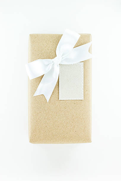 istock Wrapped vintage gift box with white ribbon bow 502103152