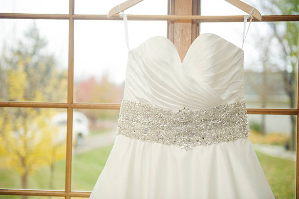 A closeup of a wedding dress.