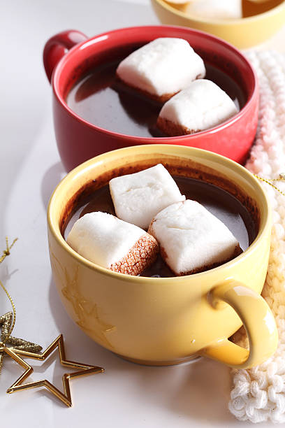 istock chocolate drink in yellow cup and marshmallows 502105800