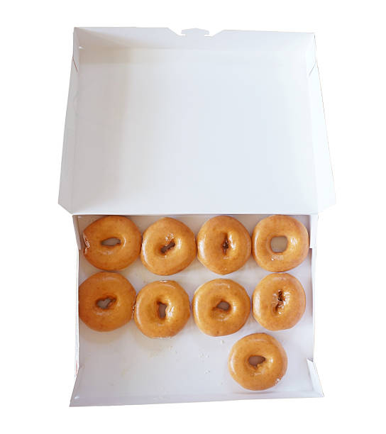 istock box of fresh donuts isolated on white 502113279