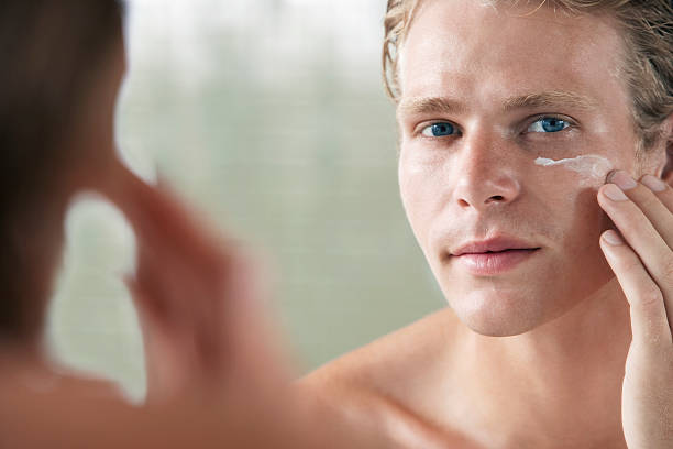 istock Man Applying Facial Cream 502114263