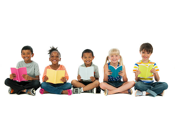Diverse Kids Portrait of diverse group of kids boy and girl reading stock pictures, royalty-free photos & images