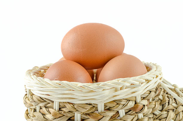 istock Brown Egg in the basket on isolated background 502116601