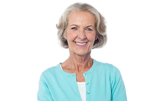 Smiling aged lady in casuals stock photo