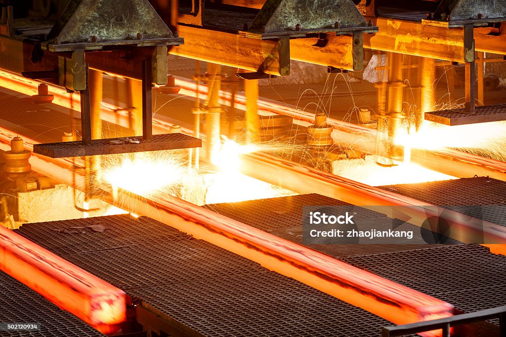 hot steel on conveyor in steel mill hot steel on conveyor Close shot in steel mill Steel Mill Stock Photo