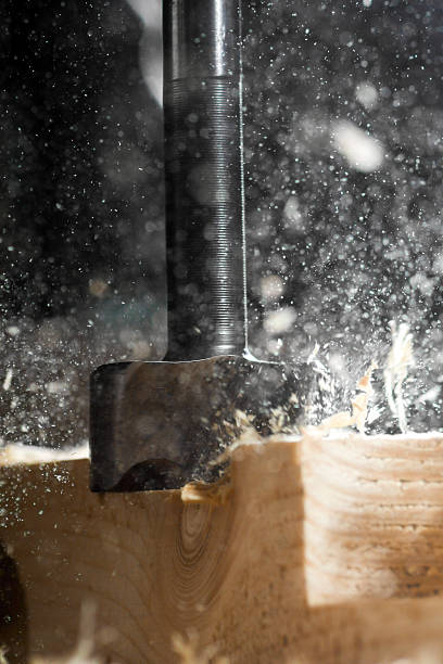 istock Drill hole makes a wooden block 502126192