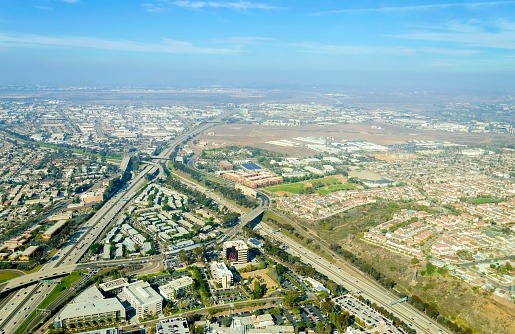 Aerial view of Midway District neighborhood and San Diego International Airport (Lindbergh Field), in Southern California, United States of America. Dominated by multi lane roads with heavy traffic