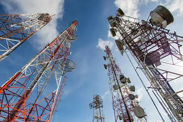 Telecommunication mast TV antennas wireless technology with blue sky