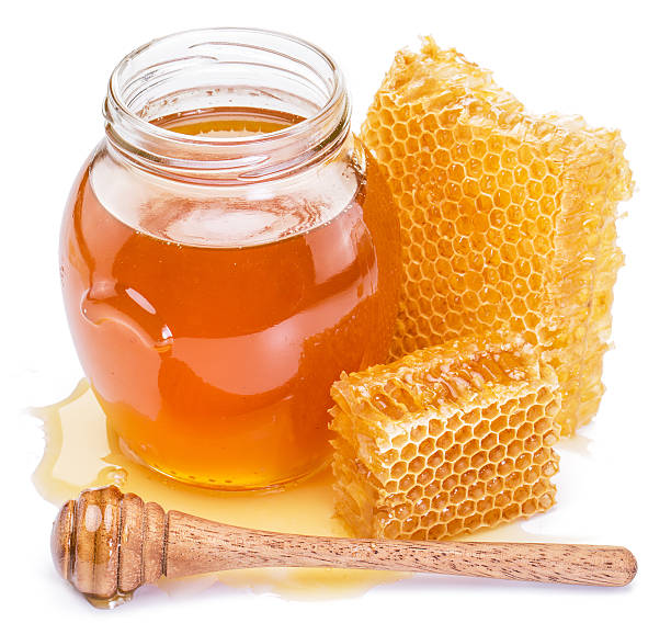 Honeycomb and pot of fresh honey.