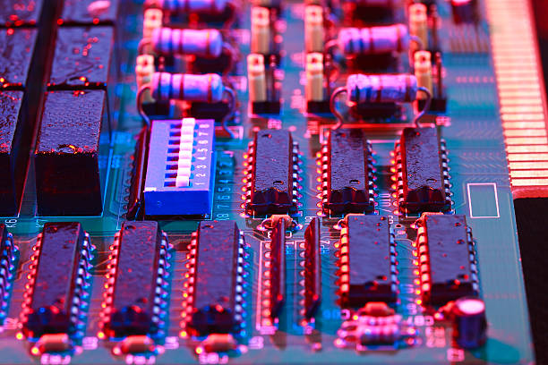 istock Red light of circuit board with processor close-up 502129664