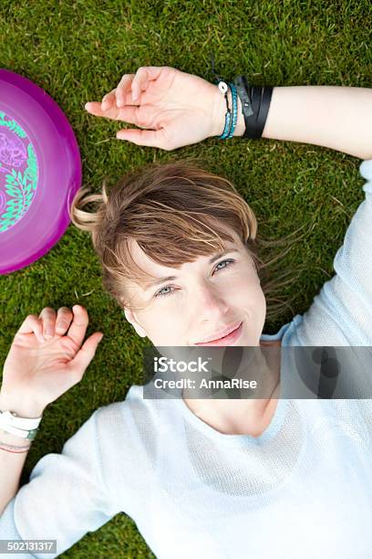 Frisbee Player Relaxing Stock Photo - Download Image Now - 20-29 Years, 25-29 Years, Adult
