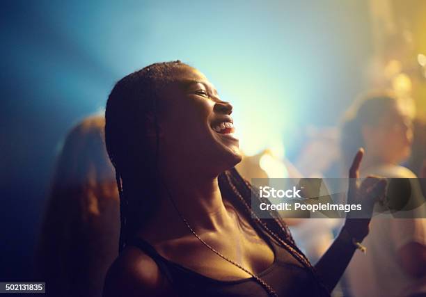 Letting The Music Take Over Her Stock Photo - Download Image Now - Dancing, Party - Social Event, Women