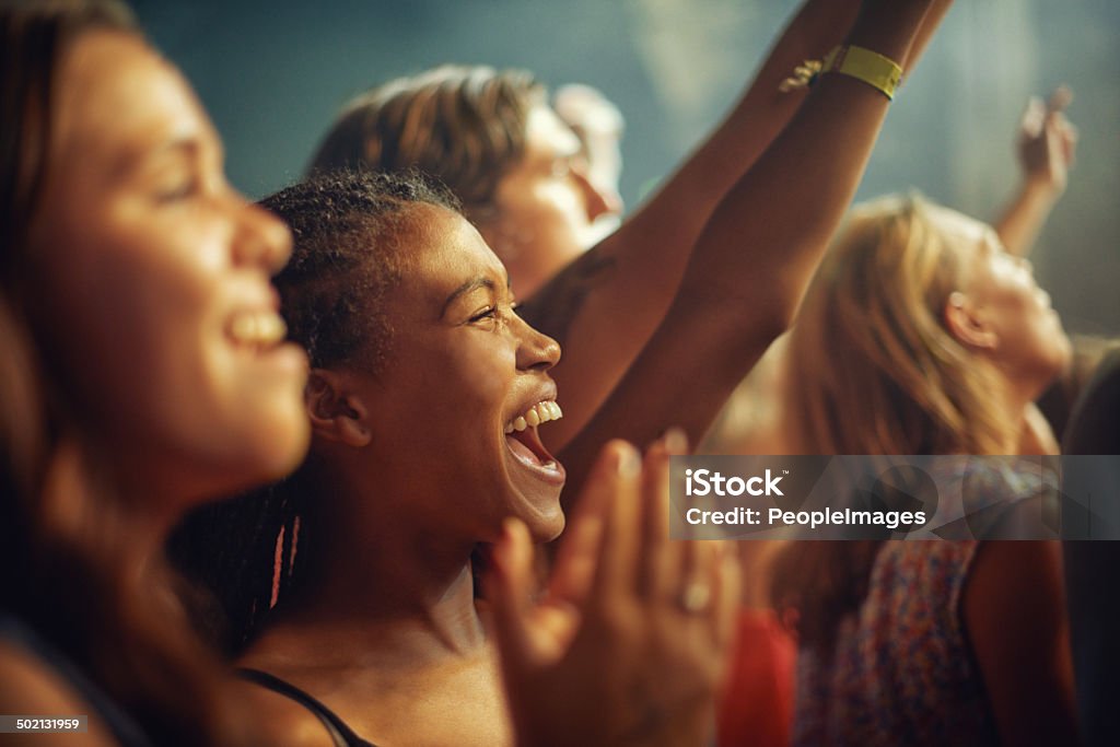 The best fans a band could want Young girls in an audience enjoying their favourite band's performancehttp://195.154.178.81/DATA/i_collage/pi/shoots/782611.jpg Performance Stock Photo