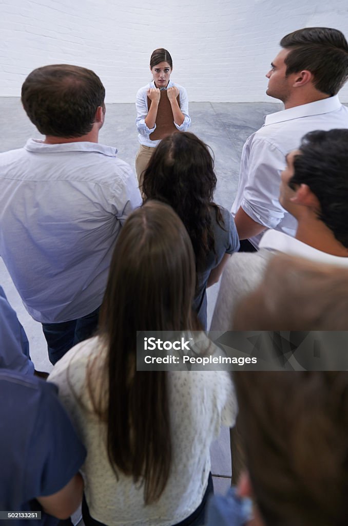 It's not my fault! Shot of an fearful young woman facing the accusatory stares of her coworkershttp://195.154.178.81/DATA/i_collage/pi/shoots/783578.jpg Adult Stock Photo