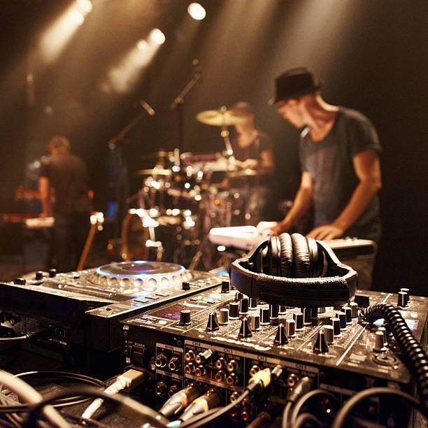 There's gonna be magic on this stage A young dj in front of his equipmenthttp://195.154.178.81/DATA/i_collage/pi/shoots/782588.jpg stage performance space photos stock pictures, royalty-free photos & images