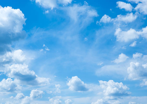 istock White fluffy clouds in the blue sky 502133767
