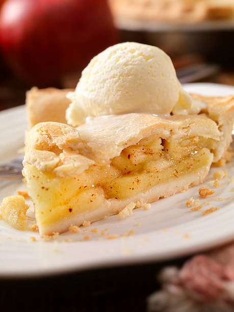 Apple Pie with Vanilla Ice Cream Apple Pie with Vanilla Ice Cream -Photographed on Hasselblad H3D2-39mb Camera apple pie and ice cream stock pictures, royalty-free photos & images