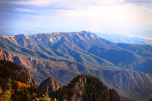 sndia mountain range, new mexico - new mexico landscape sky ethereal stock-fotos und bilder