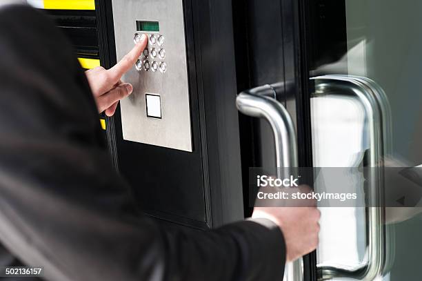 Man Entering Security Code To Unlock The Door Stock Photo - Download Image Now - Accessibility, Control, Security