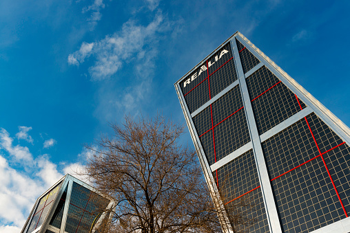 Madrid, Spain - January 19, 2014: Low-angle inclined view of the Kio Towers (Puerta de Europa), 