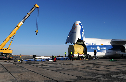 Baikonur, Kazakhstan - November 11, 2013: Russian Volga-Dnepr Antonov AN-124 long-range heavy transport plane is being unloaded in Yubileiny airport