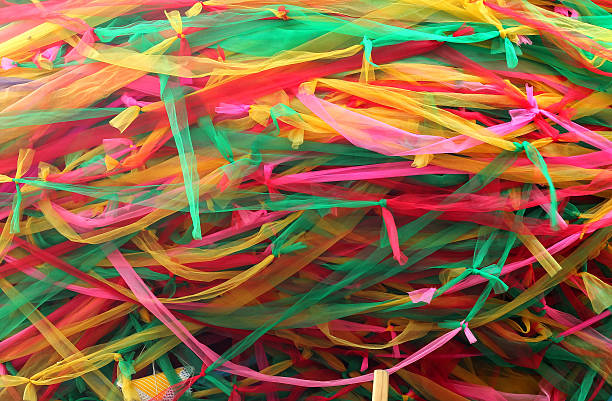 istock Strips of different colored fabric ribbons decorate a bodhi tree 502148126