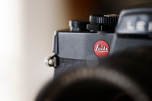 Antibes, France - December 20, 2015: Detail shot of the Leica R4 single-lens reflex (SLR) film camera. Several Leica R4 models were produced by by the Leitz company between between 1980 and 1987; the Leitz company changed its name to Leica in 1987. The R-System, produced in cooperation with Minolta Corporation during iterations R4 until R7, was discontinued in 2009.