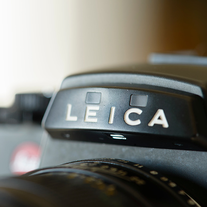 Antibes, France - December 20, 2015: Detail shot of the Leica R4 single-lens reflex (SLR) film camera. Several Leica R4 models were produced by by the Leitz company between between 1980 and 1987; the Leitz company changed its name to Leica in 1987. The R-System, produced in cooperation with Minolta Corporation during iterations R4 until R7, was discontinued in 2009.